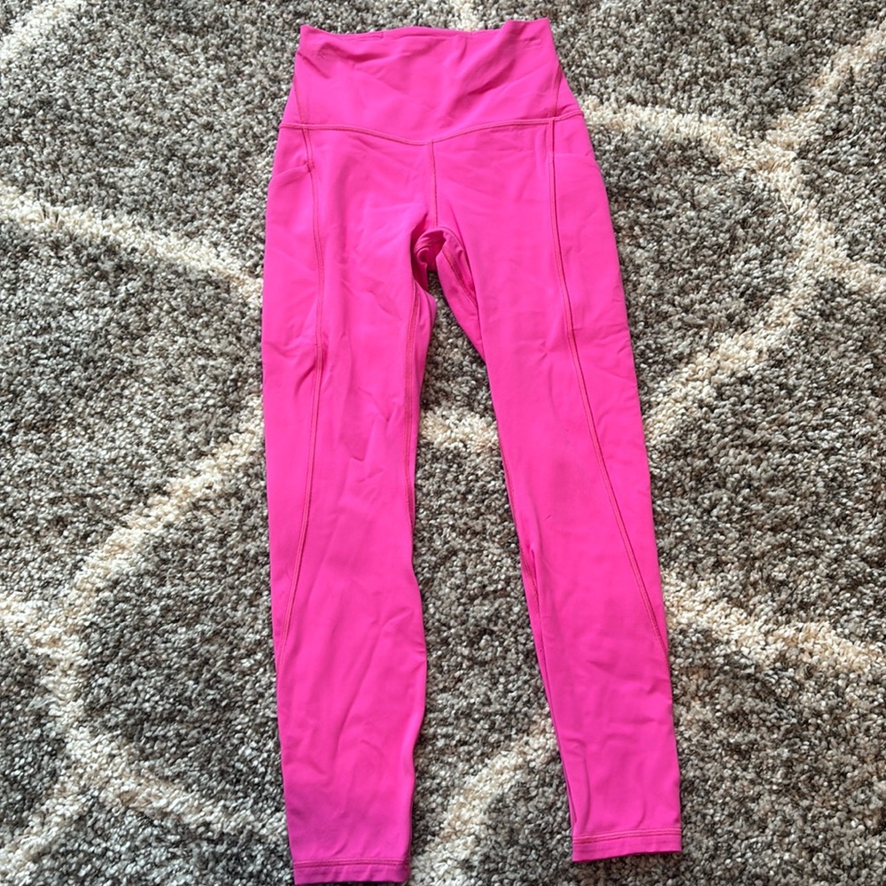 Brand new sonic pink lululemon leggings size 4 25”.